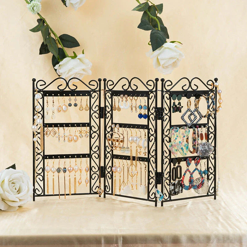 Premium metal jewelry display rack with European-inspired design, foldable for compact storage, and versatile earring and necklace organization.