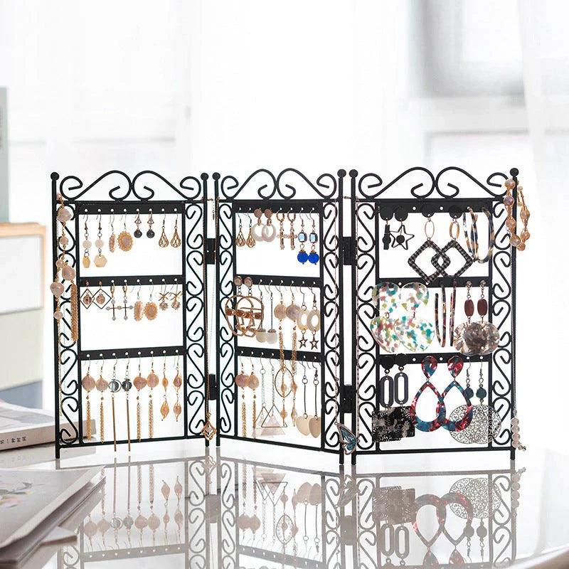 Premium metal jewelry display rack with European-inspired design, foldable for compact storage, and versatile earring and necklace organization.