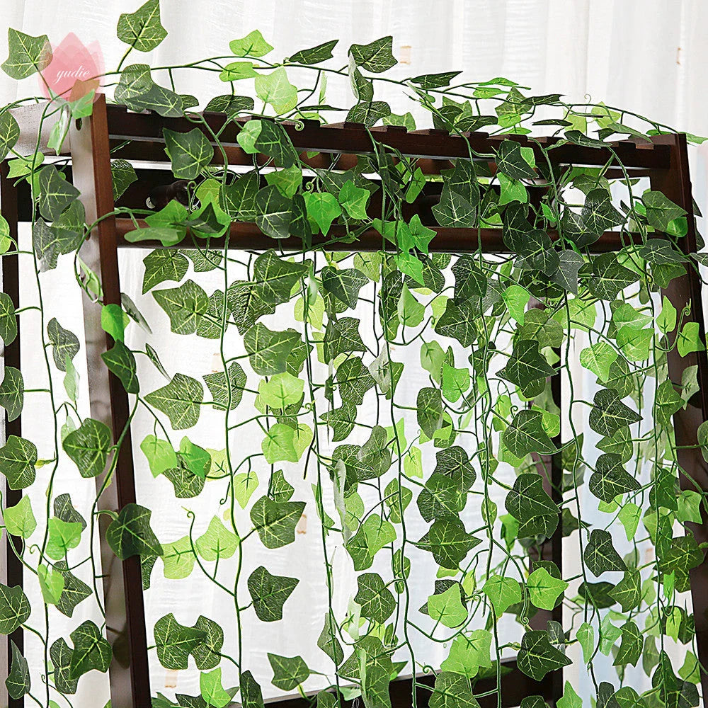 Premium silk hanging leaf garland with realistic green leaves and flexible rattan vine for customizable home, wedding, and garden decor