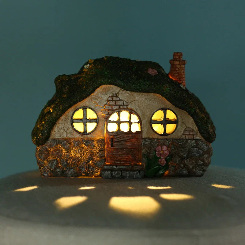 Solar-powered fairy house lamp with warm LED lighting for outdoor garden and patio decor