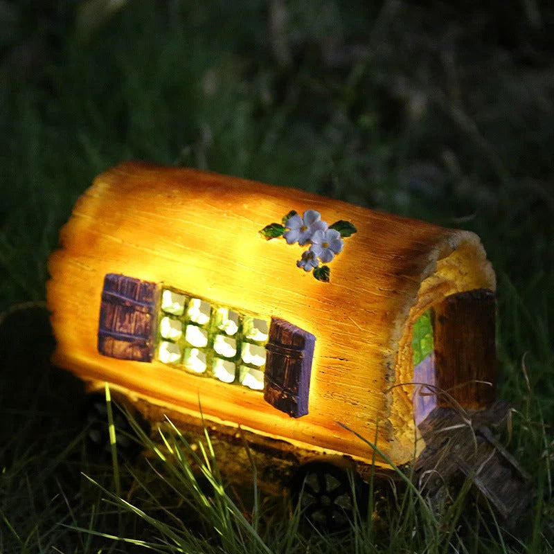 Solar-powered fairy house lamp with warm LED lighting for outdoor garden and patio decor