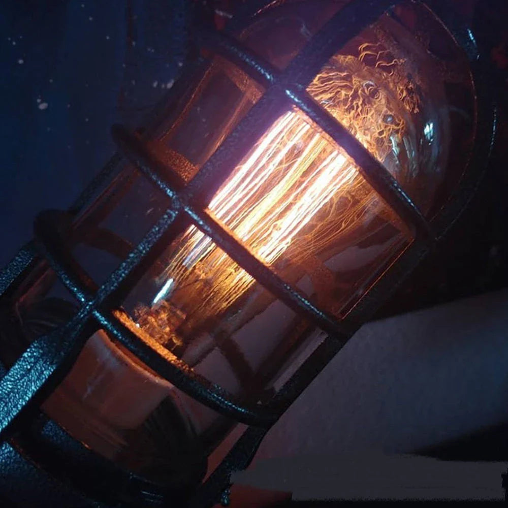 A sleek, steampunk-inspired rocket-shaped lamp with a warm, atmospheric glow, perfect for adding vintage charm to any home decor