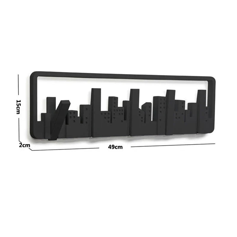 Wall-mounted coat rack with five flip-down hooks for organizing coats, hats, and other accessories