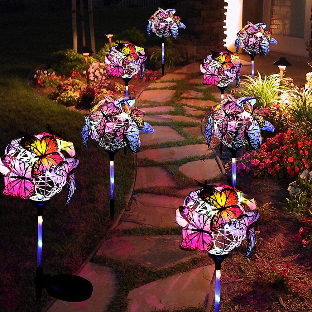 Elegant solar-powered butterfly garden lights with sleek black and transparent design, creating a captivating display in an outdoor setting