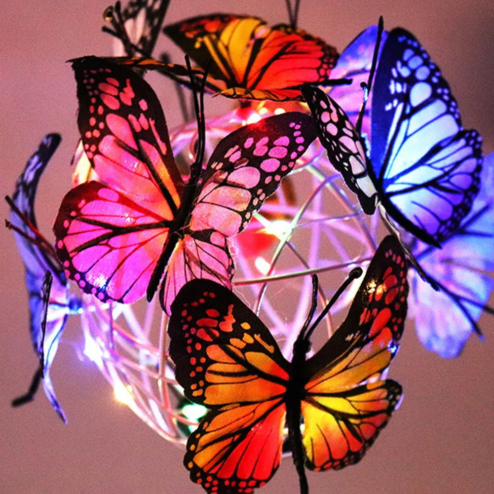 Elegant solar-powered butterfly garden lights with sleek black and transparent design, creating a captivating display in an outdoor setting