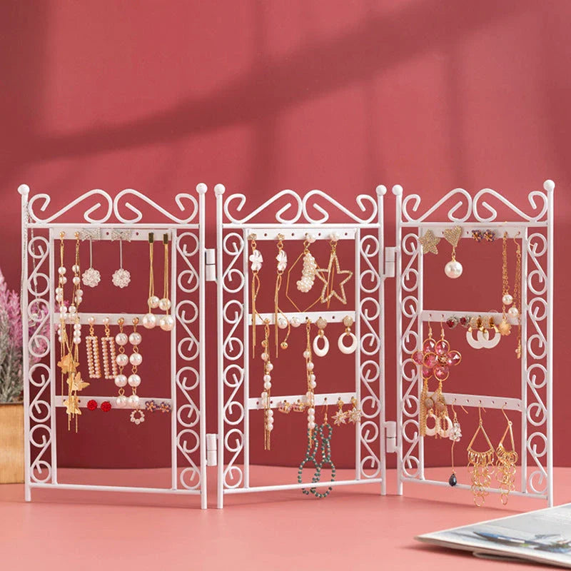Premium metal jewelry display rack with European-inspired design, foldable for compact storage, and versatile earring and necklace organization.