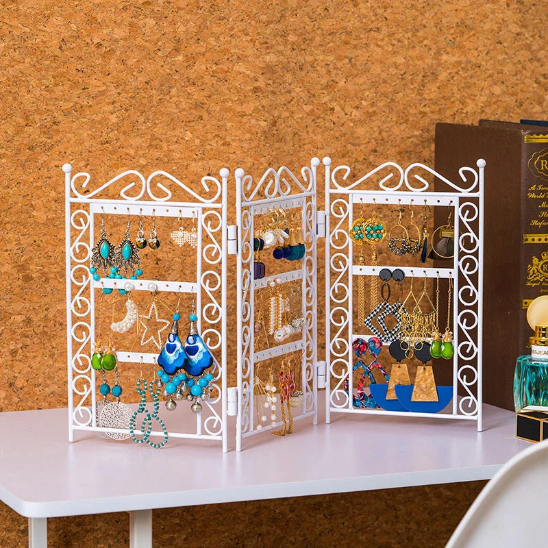 Premium metal jewelry display rack with European-inspired design, foldable for compact storage, and versatile earring and necklace organization.