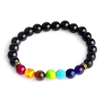 Handcrafted beaded bracelet with seven chakra-representing beads, designed to promote balance and well-being.