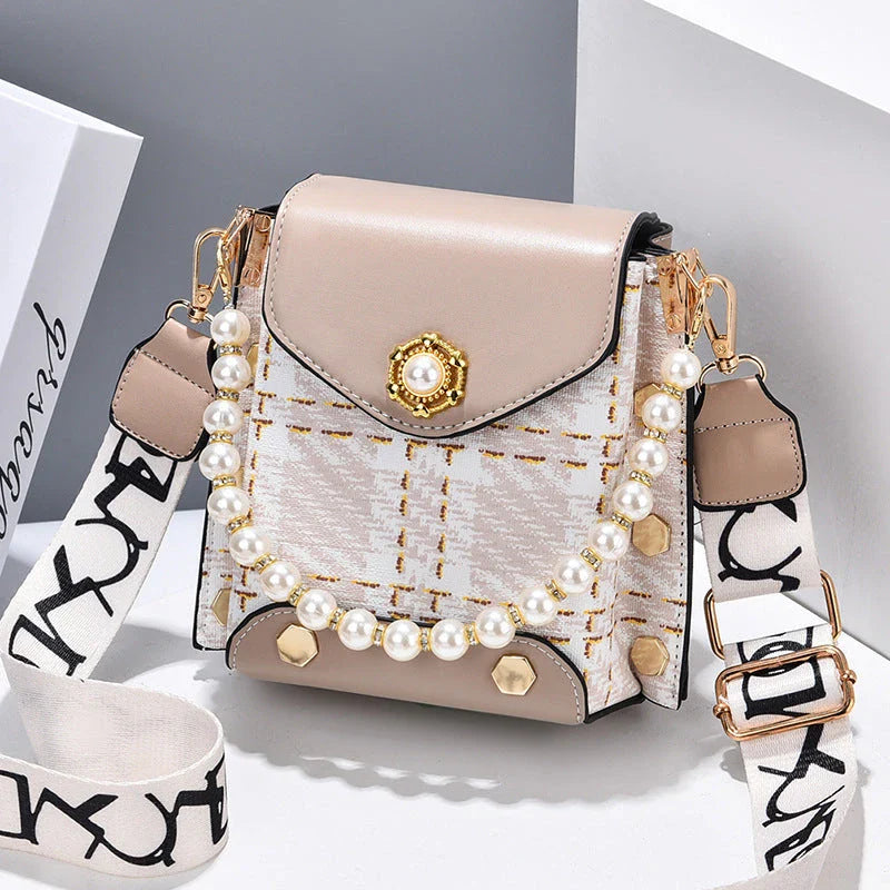 Stylish crossbody bag for women with delicate pearl pendant and adjustable strap for versatile carrying options
