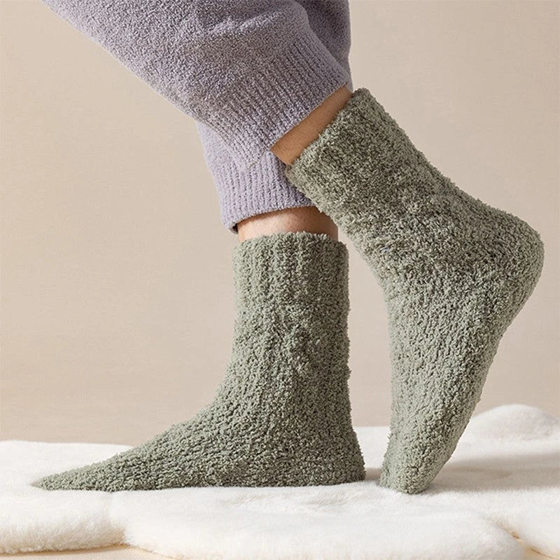 Plush coral fleece socks in various colors, designed for cozy and comfortable home wear