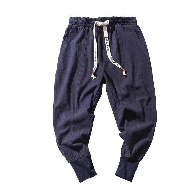 Men's harem trousers made of soft cotton and linen, featuring an elastic waistband and relaxed silhouette for all-day comfort.