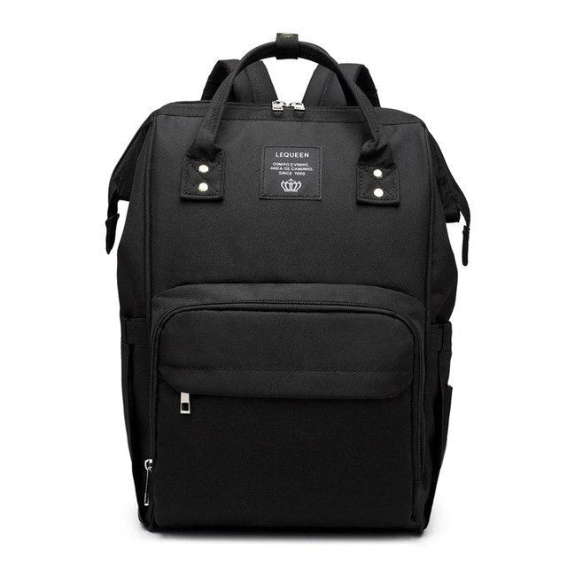 Stylish maternity diaper bag in various colors, featuring a paper bag design, separate bottle compartment, and discreet breastfeeding button.