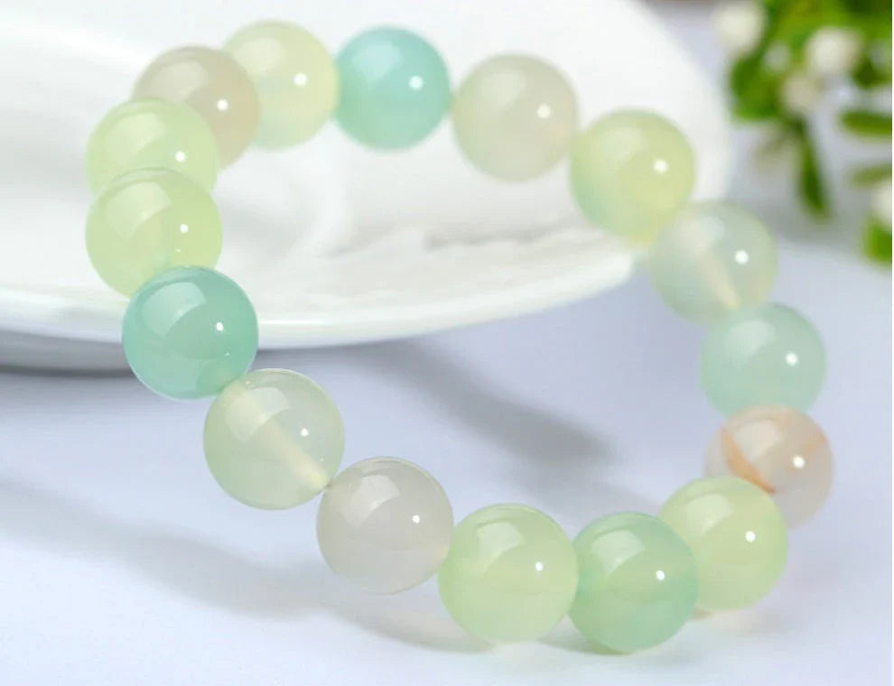 Handcrafted beaded bracelet with seven chakra-representing beads, designed to promote balance and well-being.