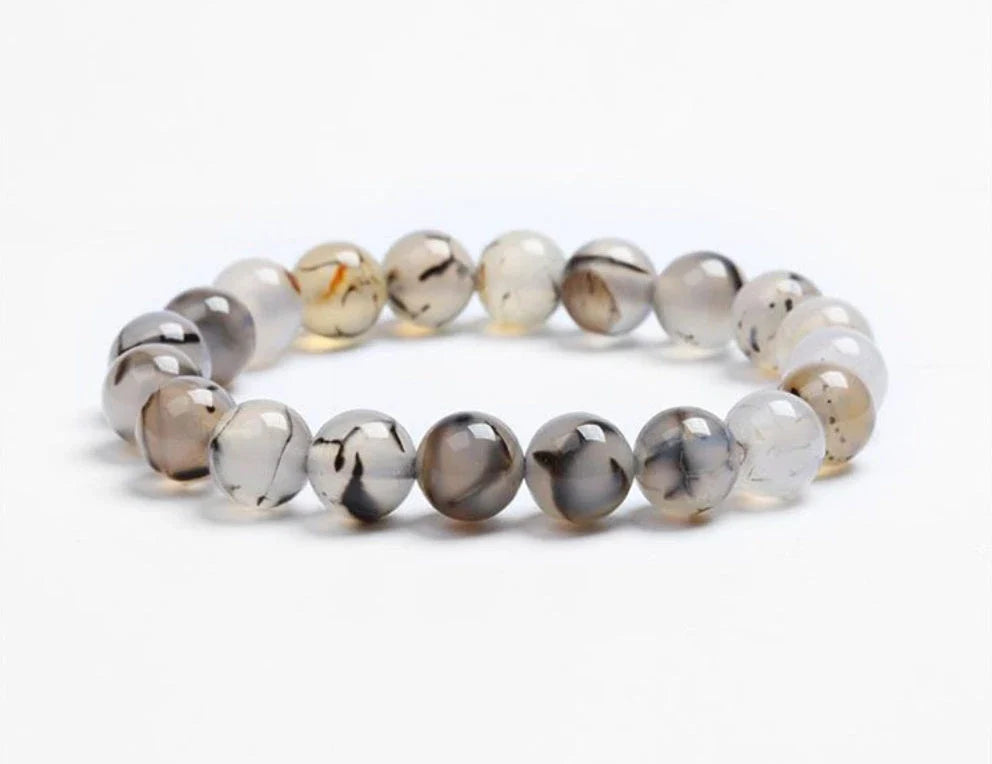 Handcrafted beaded bracelet with seven chakra-representing beads, designed to promote balance and well-being.