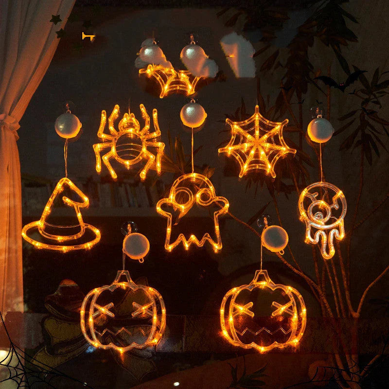 Spooky Halloween window lights featuring ghostly silhouettes, carved pumpkins, and creepy spiders for festive seasonal decor