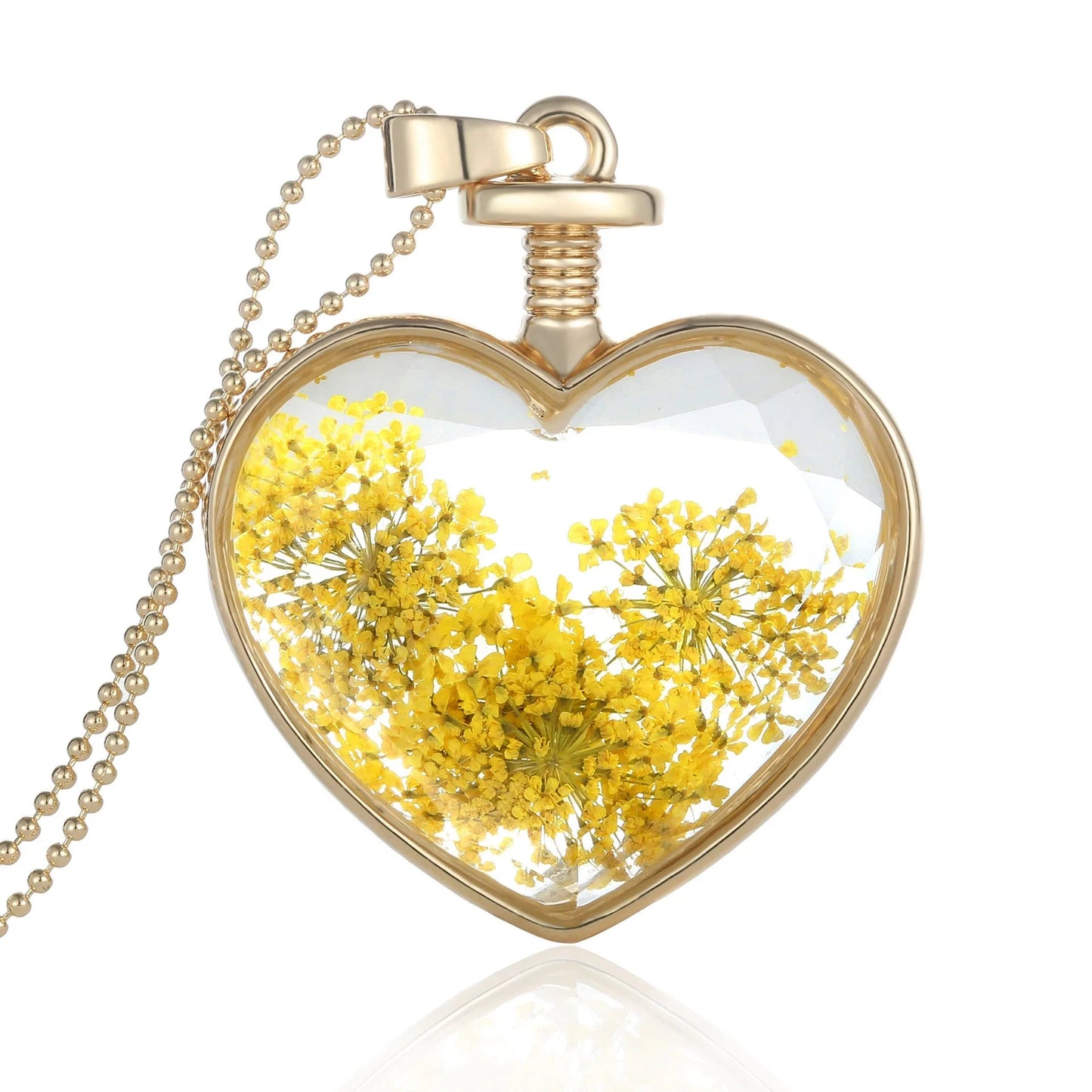 Elegant floral pendant necklace with a dried flower charm on a gold-tone chain