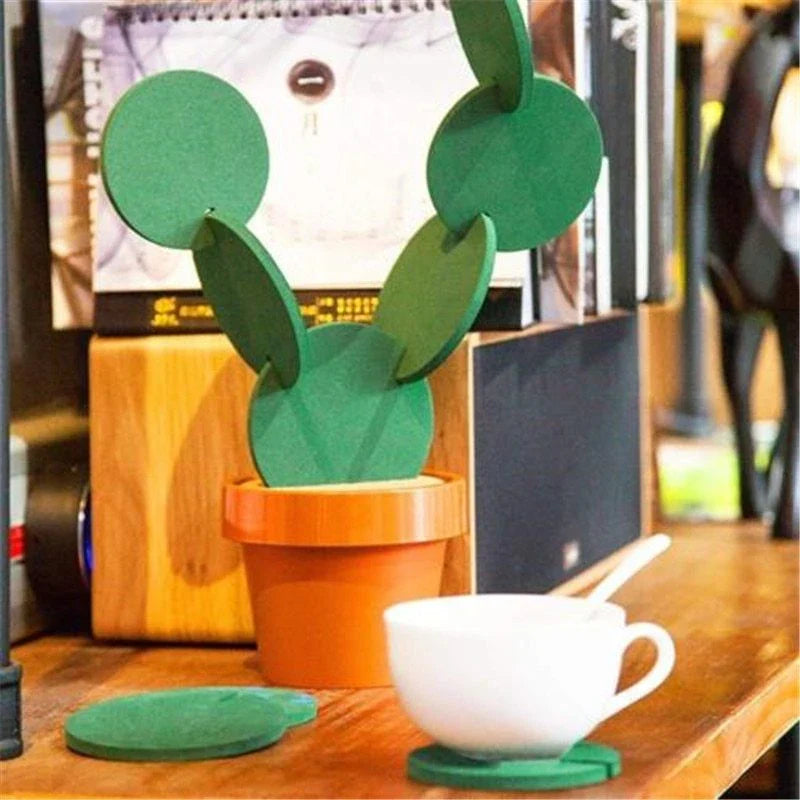 Stylish cactus-shaped coasters in a flowerpot-style holder, protecting a table from hot or cold drinks