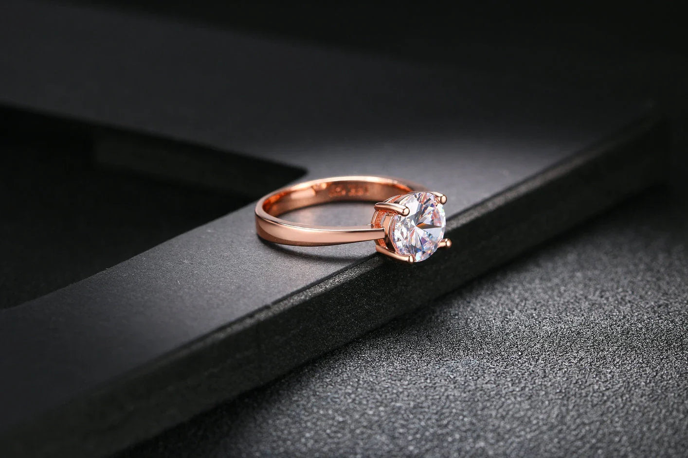 Close-up of a beautiful rose gold ring with sparkling zircon stones