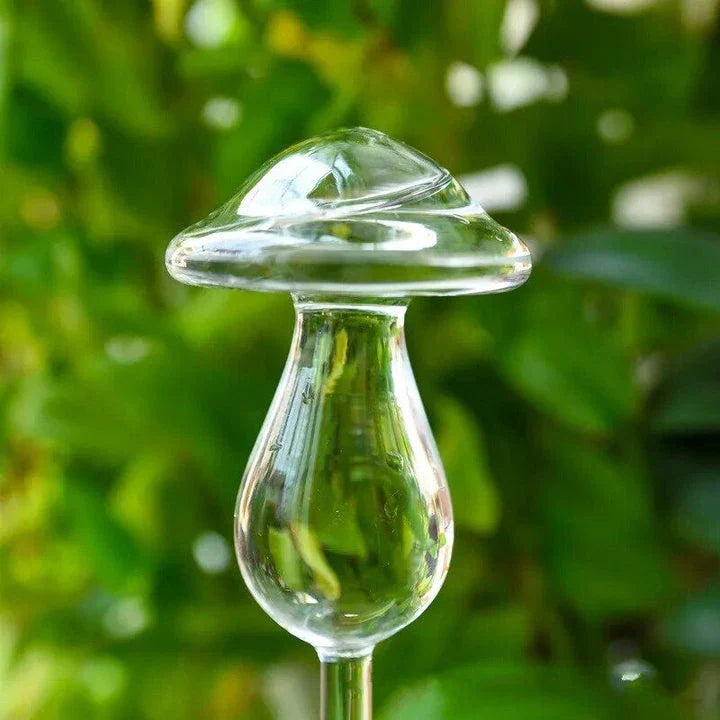 Decorative automatic plant watering device in various designs including birds, stars, and mushrooms