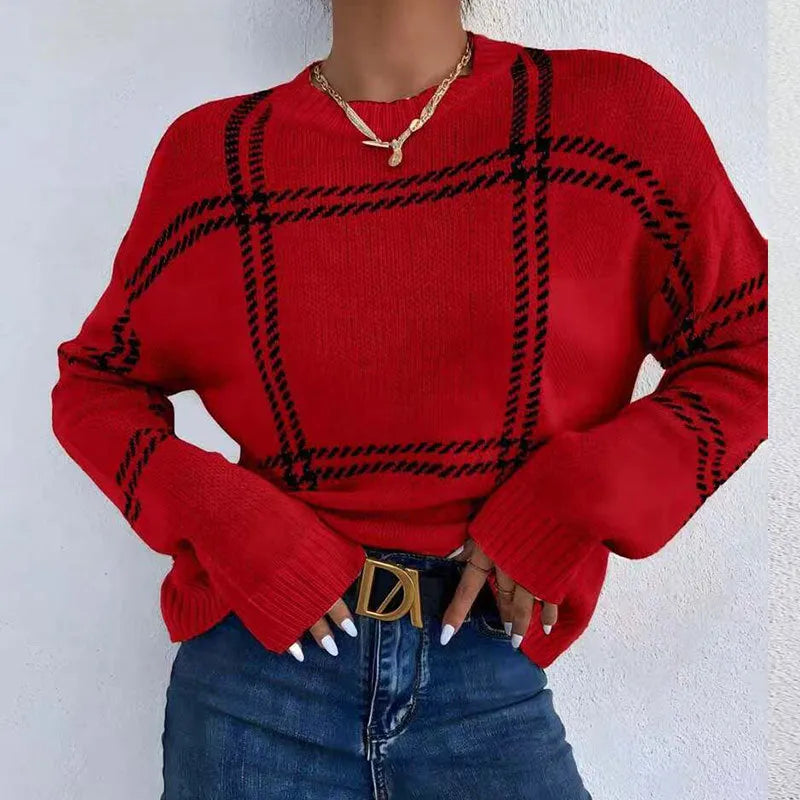 Women's loose-fitting plaid crew neck sweater with apricot, black, beige, red, and green colour-block stripes.