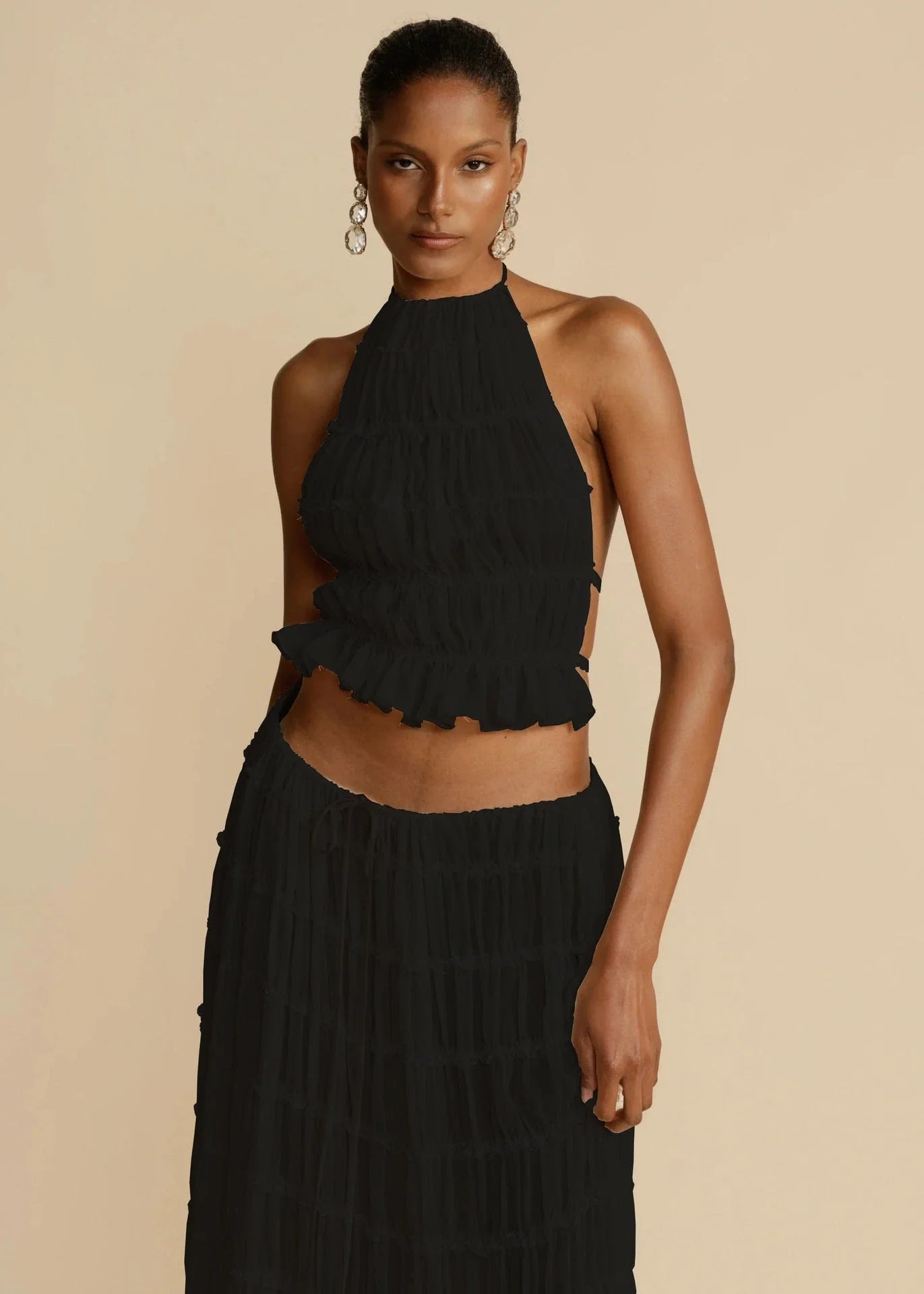 Chic backless halter top and flowing pleated maxi dress set in various vibrant colors
