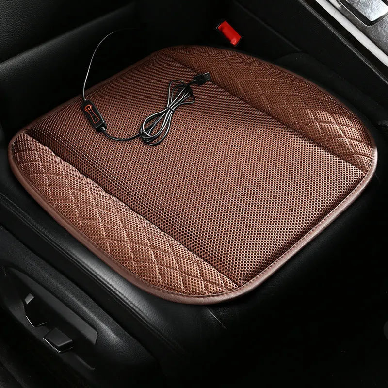 USB ventilated car seat cushion in black suede with visible fan vents, placed on a car seat.