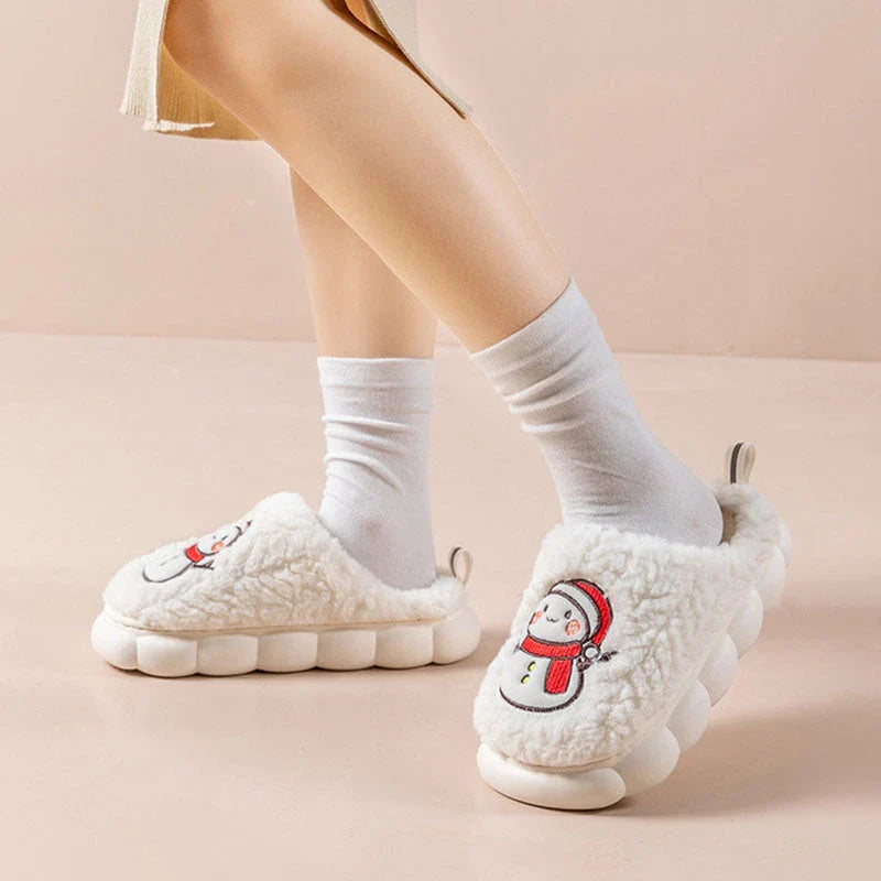 Cozy snowman-themed slippers with plush interior and thick, anti-slip soles for warm, comfortable indoor wear