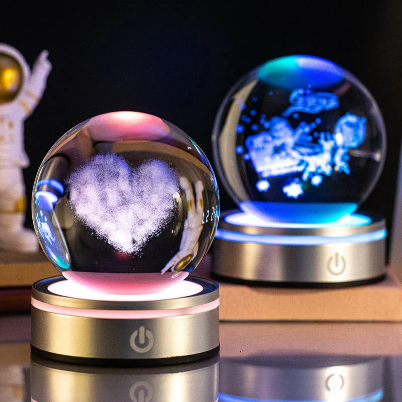 Luminous crystal ball with various celestial-inspired designs, including the Milky Way, Solar System, and Constellation.