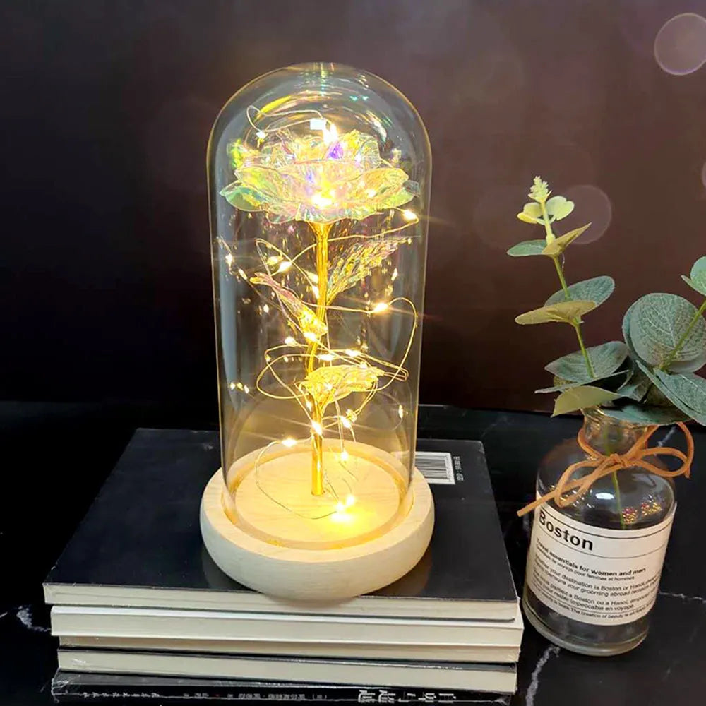 LED simulation rose ornament with glass lampshade on a solid wood base, showing a choice of rose colours.