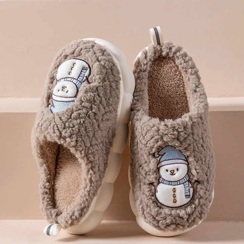 Cozy snowman-themed slippers with plush interior and thick, anti-slip soles for warm, comfortable indoor wear