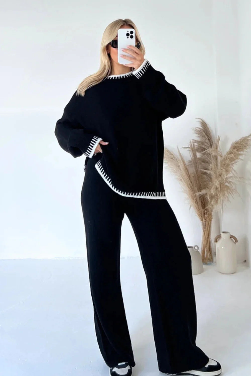Stylish women's two-piece suit set with long-sleeved top and loose pants in various colours