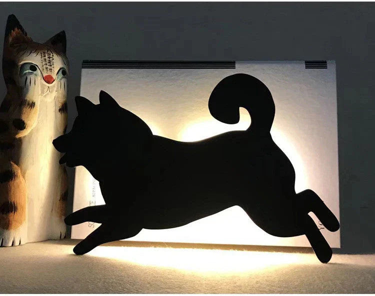 A stylish cat-themed LED lamp that automatically lights up when it detects sound, creating a cozy, ambient glow in a room.