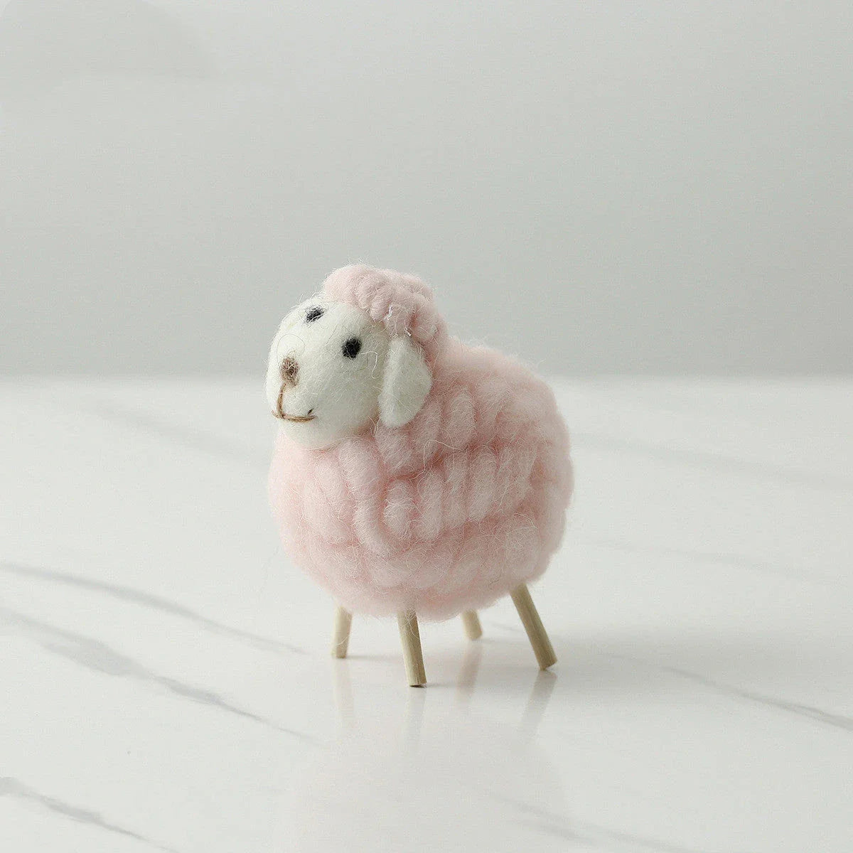 Plush sheep figurines in various colors and sizes, perfect for home decoration and gifting