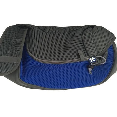 A comfortable and stylish pet sling bag with padded mesh and leather details, allowing hands-free travel for pet owners.