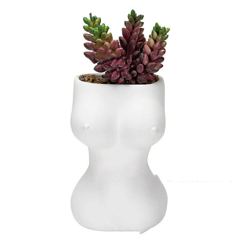Elegant ceramic flower pots in various colours, featuring intricate designs inspired by classic European styles