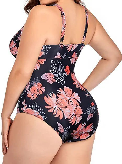 Black plus size bikini swimsuit with print design for women, shown on a hanger.