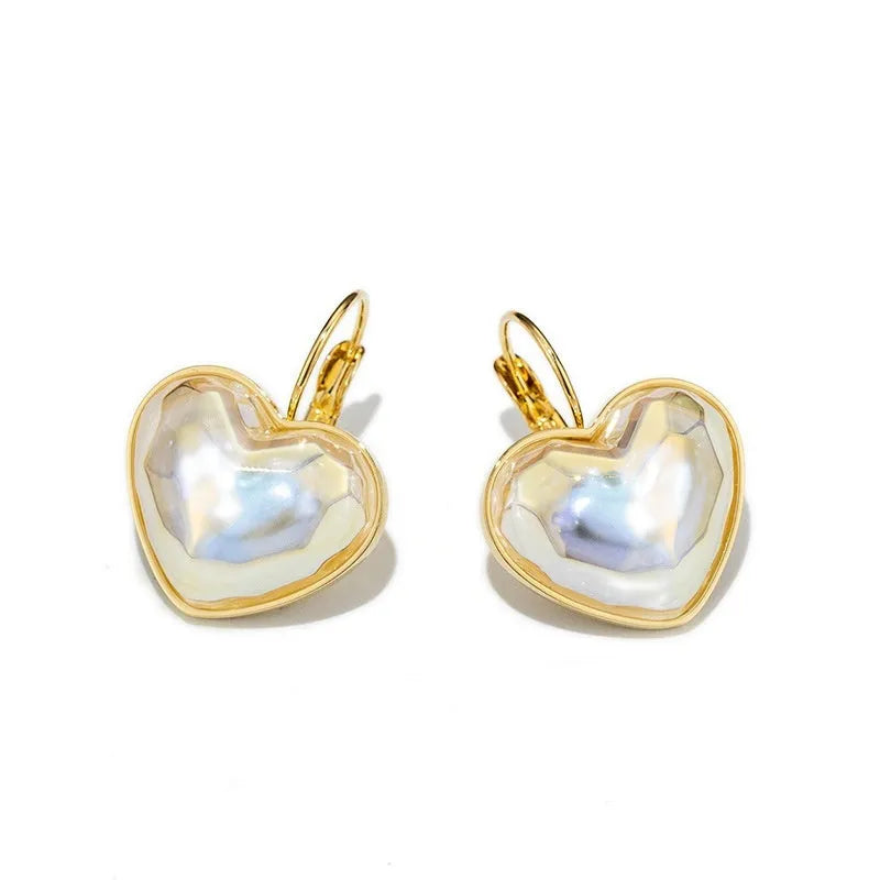 Gold-coloured alloy clip-on earring for women with a natural design.