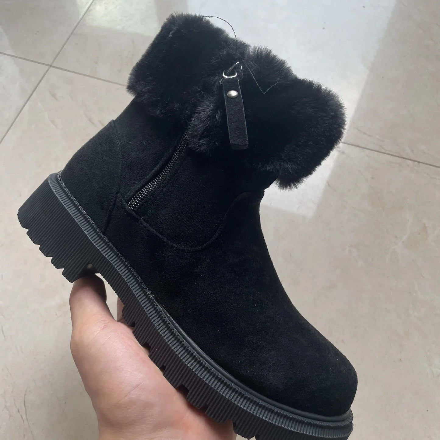 Cozy winter boots with side zipper, suede upper, and rubber sole for outdoor activities