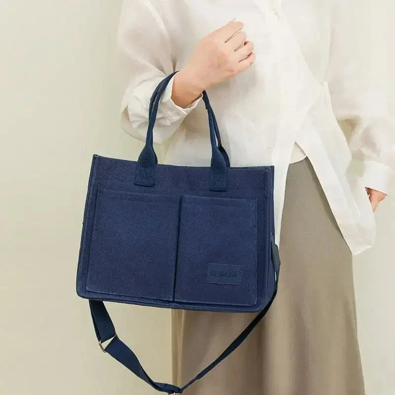 Premium canvas tote bag with multiple pockets, adjustable shoulder strap, and stylish design for everyday use