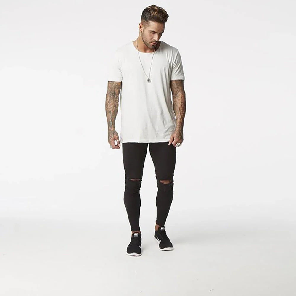 Trendy distressed black skinny jeans for men, featuring a super-elastic cotton construction and edgy, lived-in look