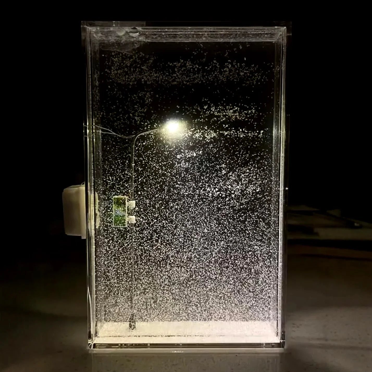Enchanting DIY snowy night light with warm LED lighting, creating a cozy winter wonderland atmosphere