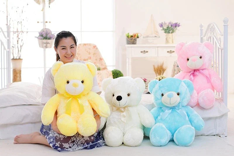 Illuminating plush teddy bear with color-changing LED lights, soft and huggable design in various sizes and colors