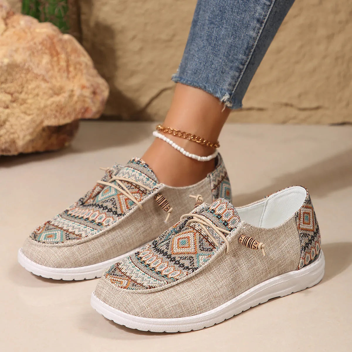 Women's black slip-on flat shoes with round toe and low-top design on a neutral background.