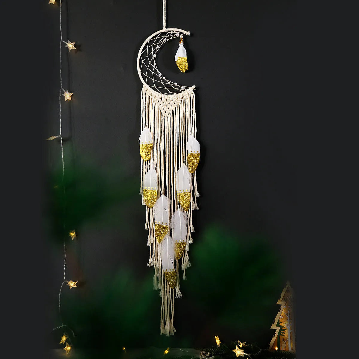 Gold crescent dream catcher wall decoration made from woven cotton thread, 20cm wide by 100cm high.