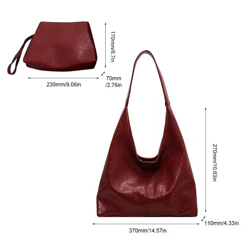 Classic vintage-inspired women's shoulder bag in a range of sophisticated colours, featuring a roomy interior, adjustable strap, and premium materials for timeless British style.