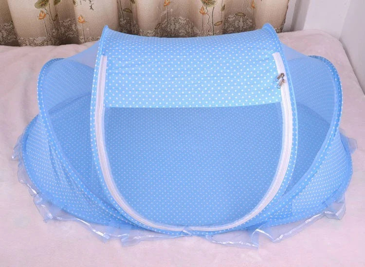 Breathable insect-free foldable baby travel cot with integrated mattress and pillow, available in blue, pink and blue-and-pink colour options