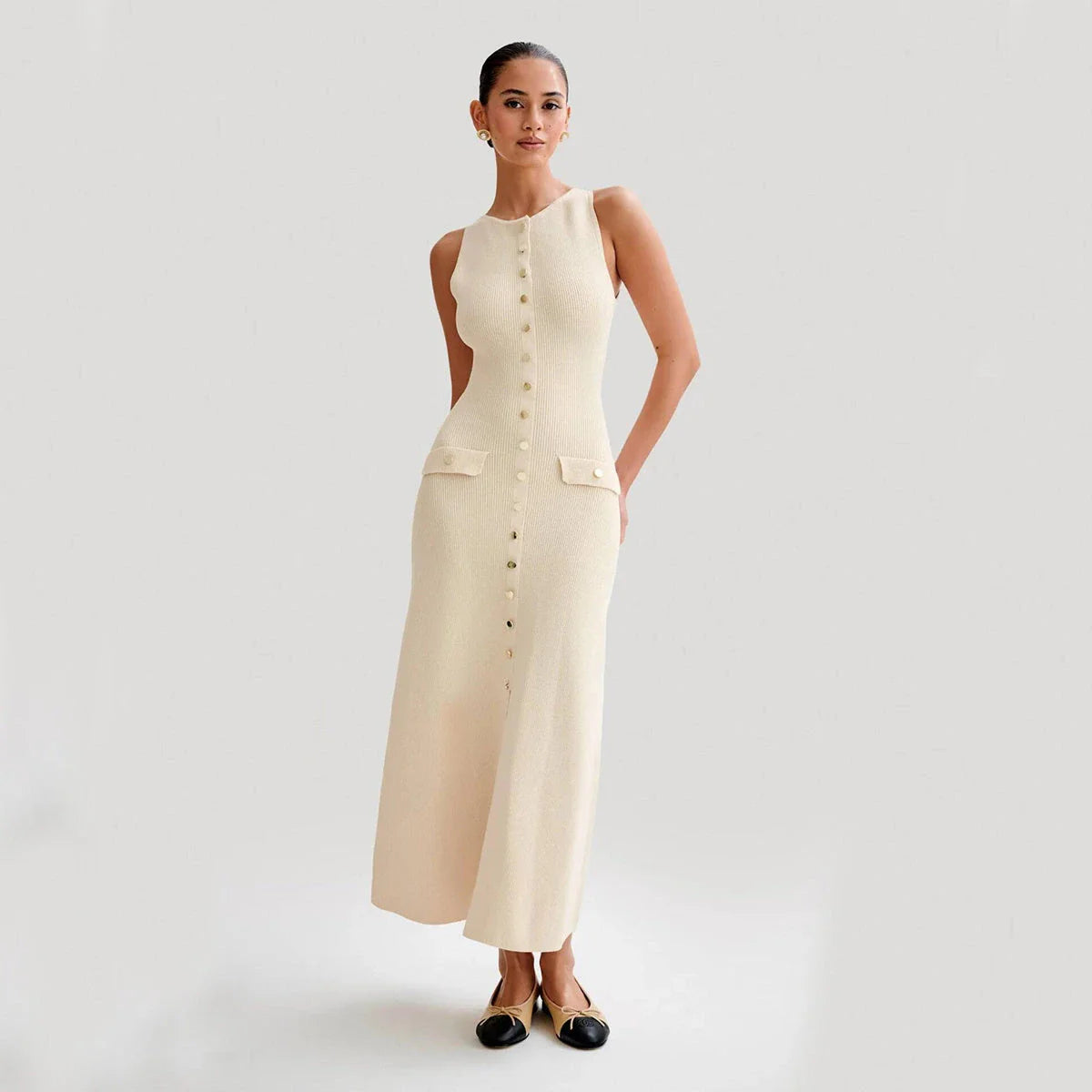 Sleeveless knit dress in apricot and blue colors, showcasing a slim, flattering silhouette and premium polyester construction