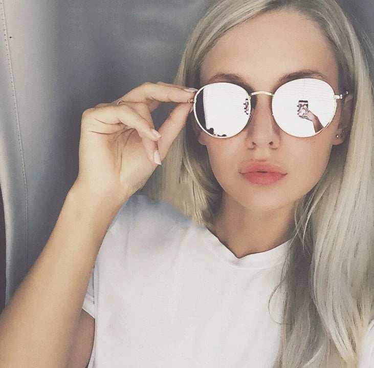 Stylish retro sunglasses for women with metal frame and glass lenses