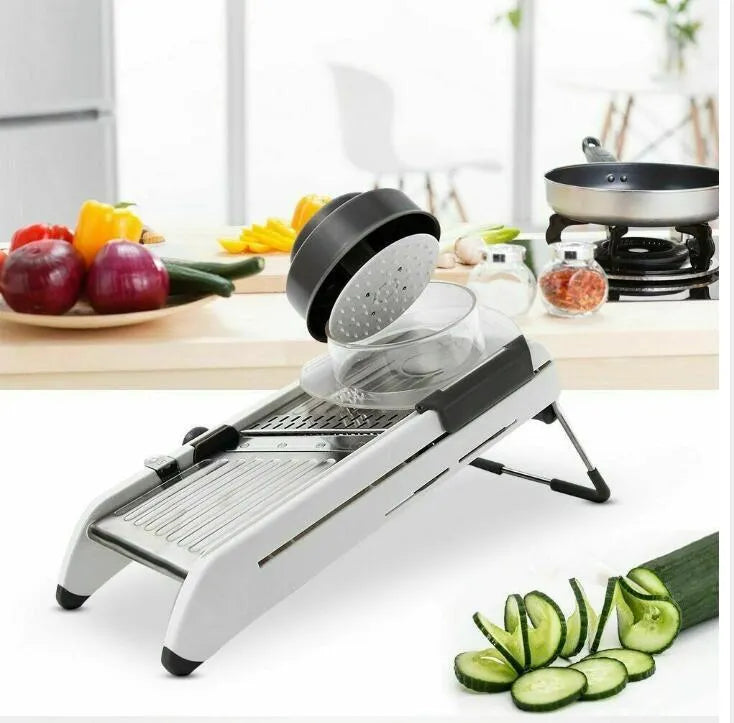 White kitchen vegetable slicer with stainless steel blades and adjustable thickness settings
