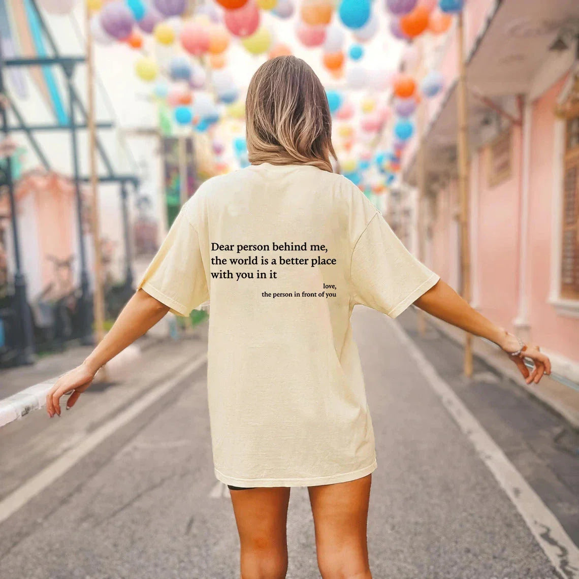 Stylish women's graphic t-shirt with trendy slogan, featuring a vibrant print design and comfortable short sleeve silhouette.